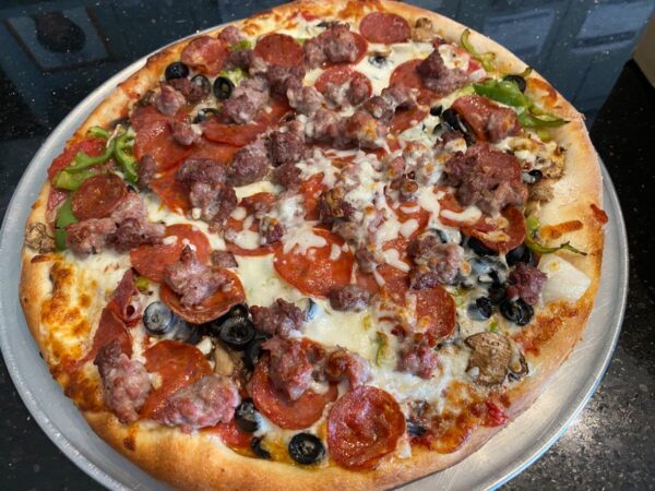 Almost Everything Pizza loaded with pepperoni, sausage, salami, ground beef, olives, bell peppers, mushrooms and onions