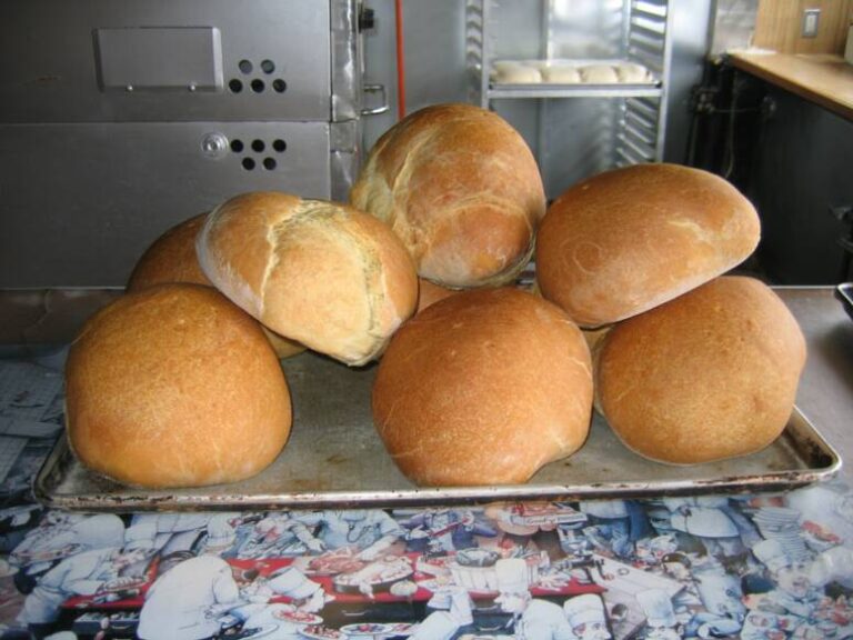 Loaves of Bravo Pizza home-made bread on a baking tray