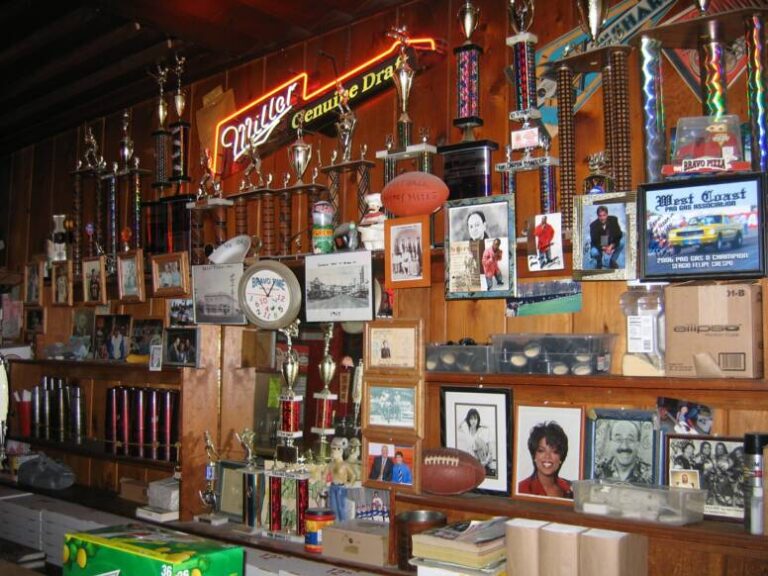 Bravo Pizza wall covered with trophies, framed photos and memorabilia
