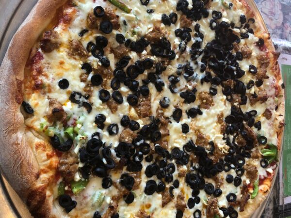 Cute Greek Pizza with feta, fresh garlic, olives, sausage and bell peppers