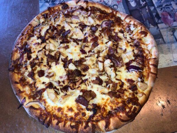Porky's Pizza with BBQ sauce, chicken, red onion and bacon